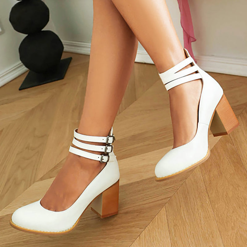 Modern women's chunky block heels & sleek ankle strap, enhancing any dressy outfit with elegance.