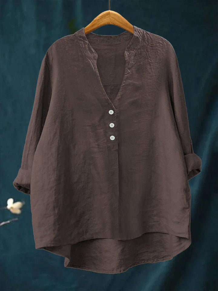 Effortless Women's Button-Front Blouse. Casual relaxed fit top featuring a stylish high-low hem for versatile fashion.