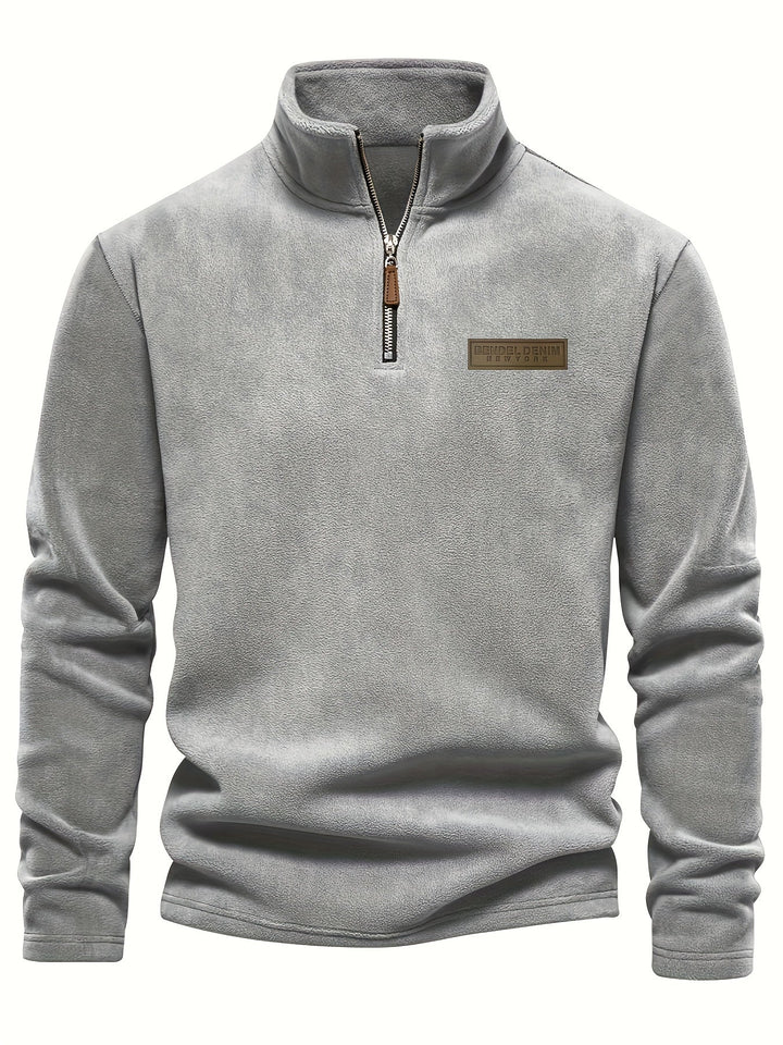 Unisex half-zip pullover, fleece-lined for ultimate warmth. Cozy winter essential for chilly days.