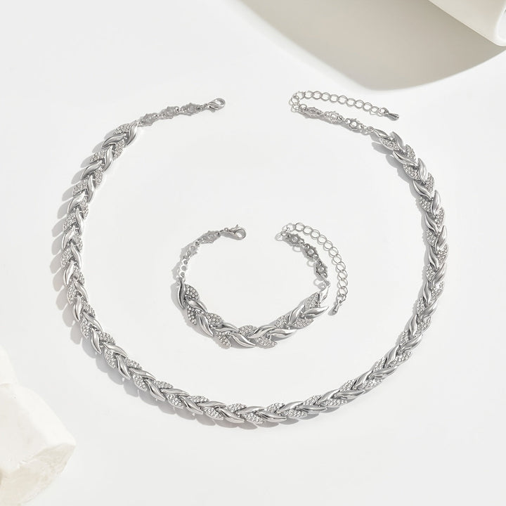 Elegant women's silver fish tail jewelry set, featuring a sparkling rhinestone necklace & bracelet for special events.