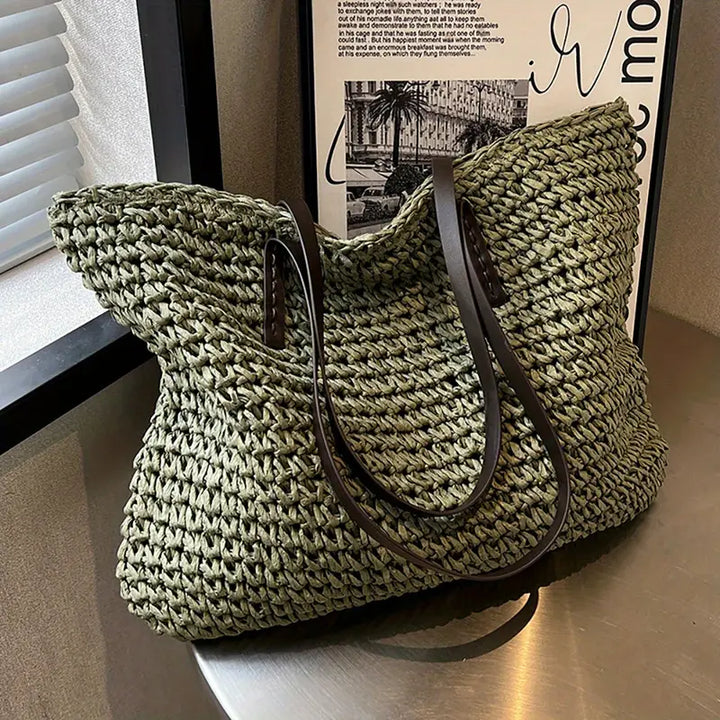 Women's spacious bohemian woven tote bag, ideal as a casual shoulder or beach bag.