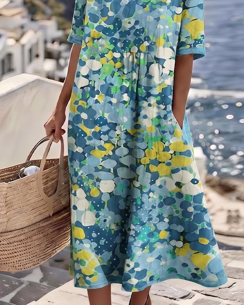 A-line women's midi dress with airy floral print, elegant and comfortable for spring fashion.