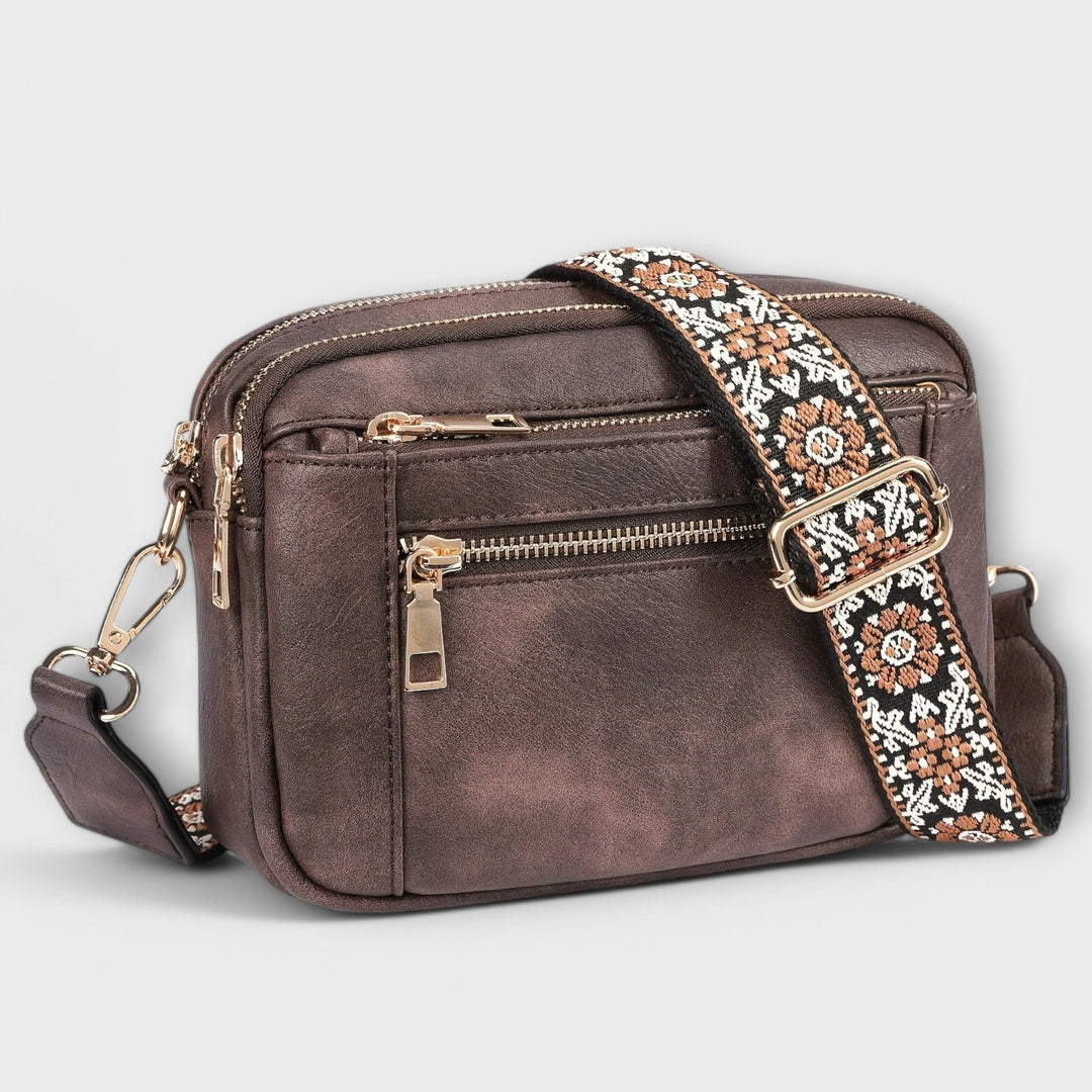 Stylish women's crossbody handbag, retro design, brown vegan leather, colorful boho adjustable strap.