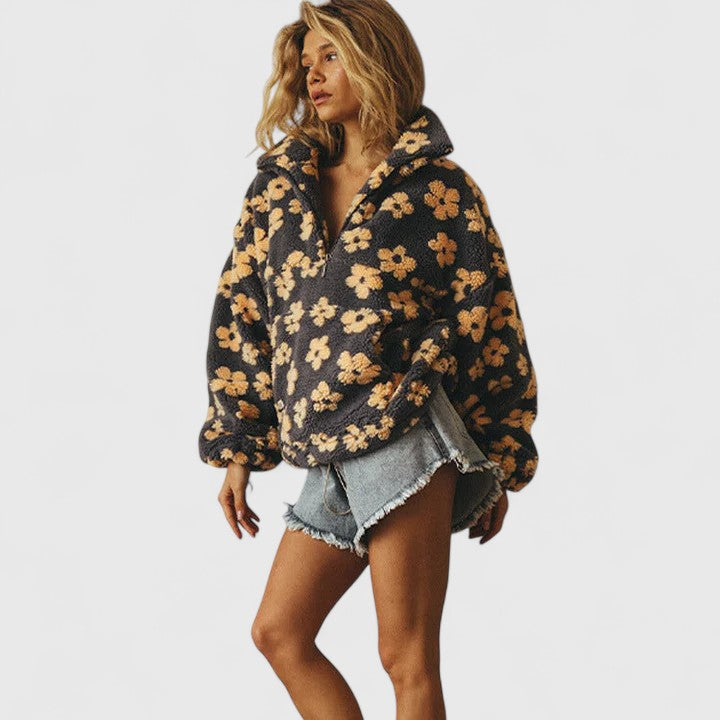 Stylish women's floral half-zip sweater, a casual long-sleeve top ideal for comfortable spring wear.