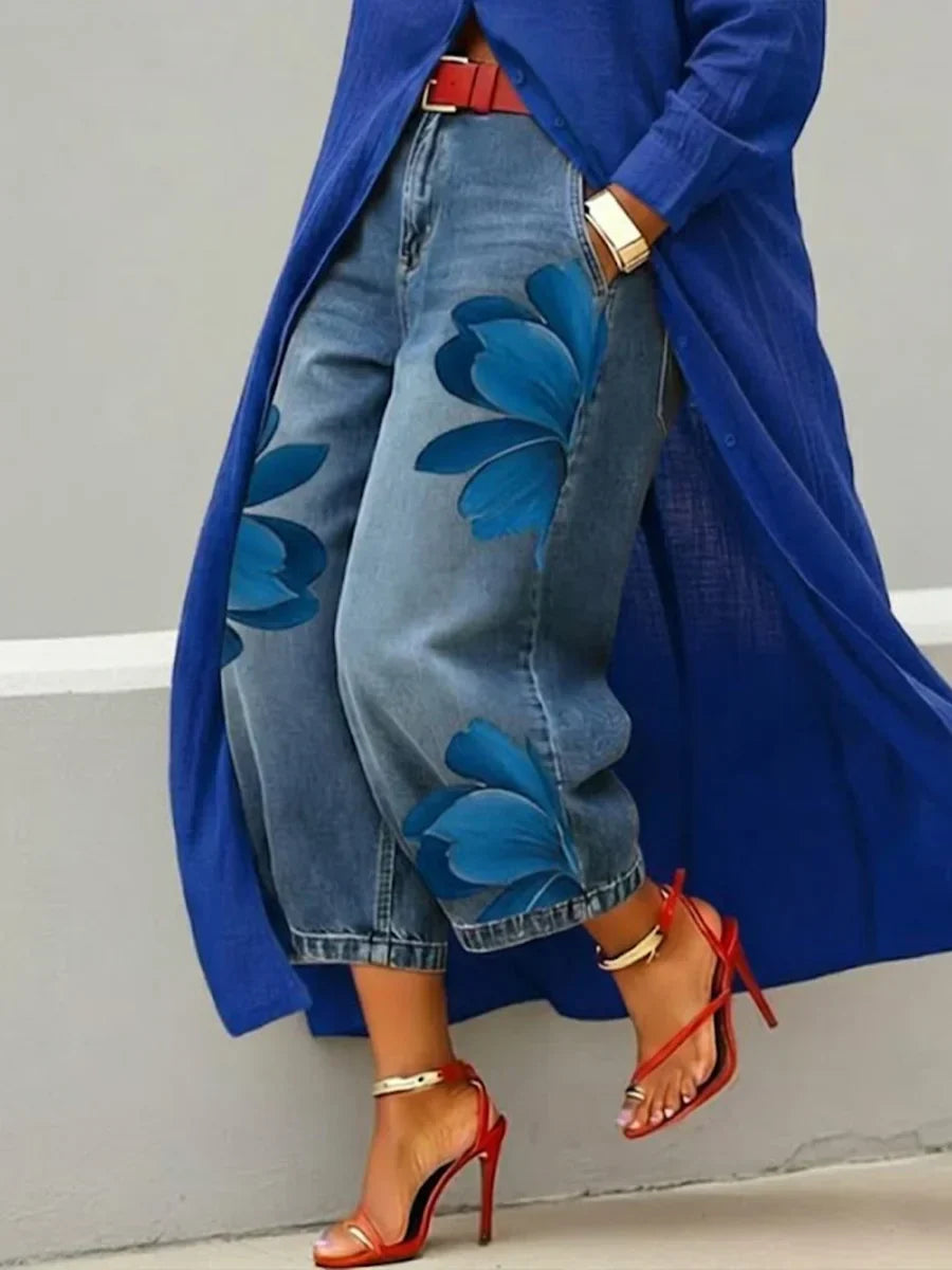 Stylish women's ensemble: a modern shirt dress and bold floral patterned jeans, ideal for casual chic.