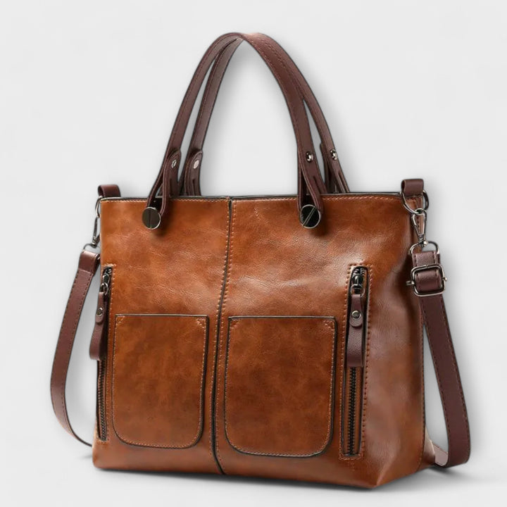 Women's classic black leather shoulder bag with an elegant design, versatile for daily use and work.
