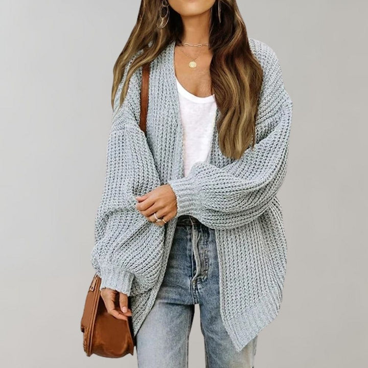 Fall/Winter women's open knit cardigan, designed with cozy fabric and fashionable bishop sleeves.