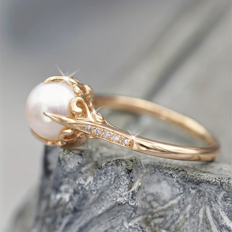 Elegant women's gold statement ring with delicate pearls & sparkling crystals. Perfect fashion accessory for women.