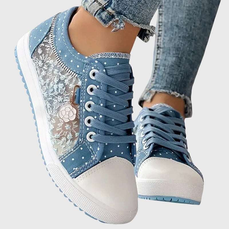 Close-up of the cushioned sole & wide toe box of women's orthopedic walking sneakers.