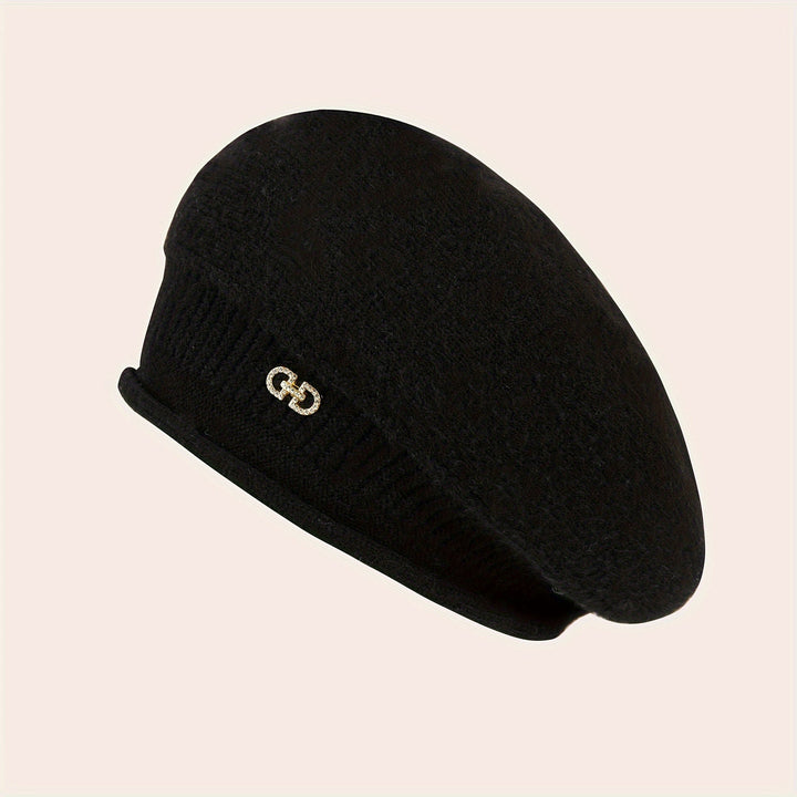 Soft knit women's beret. Fashionable winter accessory, providing warmth and chic elegance.