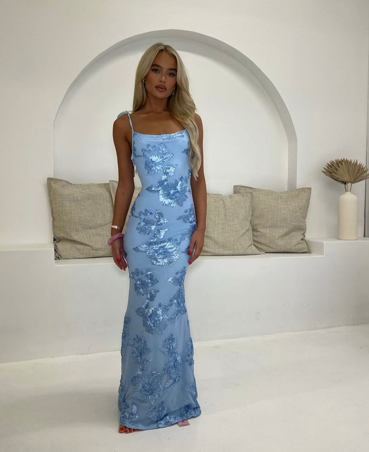 Flowing floral maxi dress for women, featuring adjustable straps, ideal for summer events & evening wear.