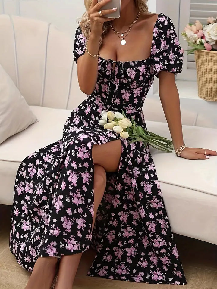 Women's floral A-line midi dress with puff sleeves, a stylish choice for spring and summer.