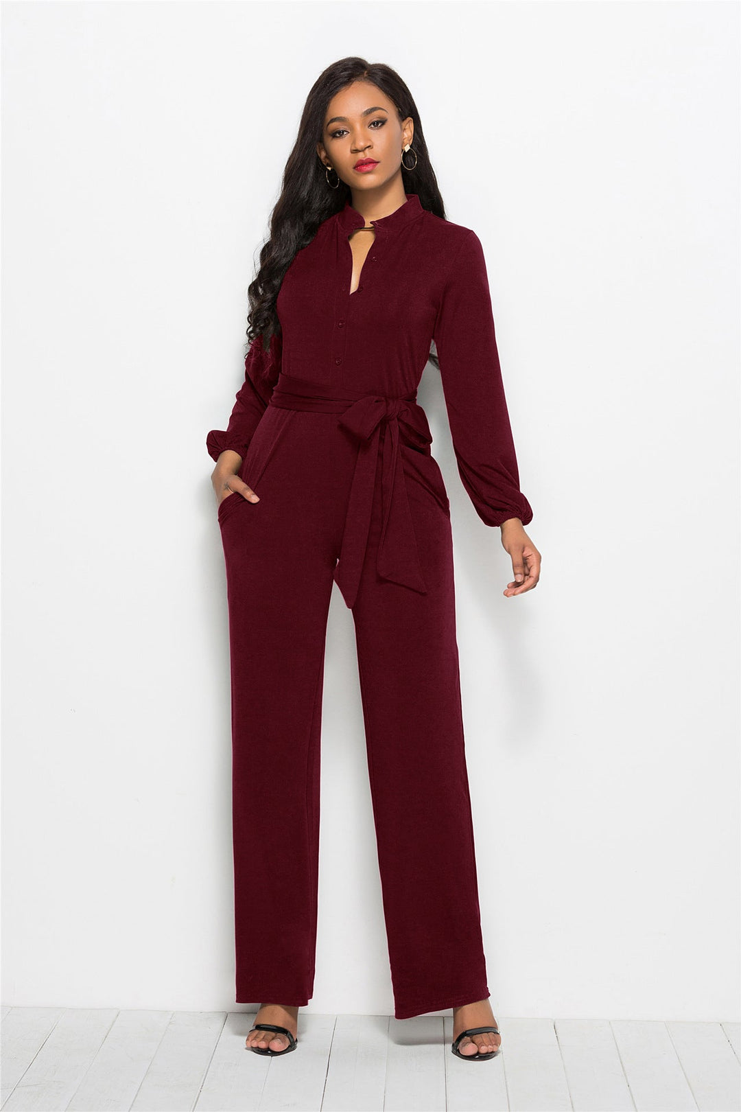 Full-length women's elegant jumpsuit, featuring a tailored fit and sophisticated long sleeves.