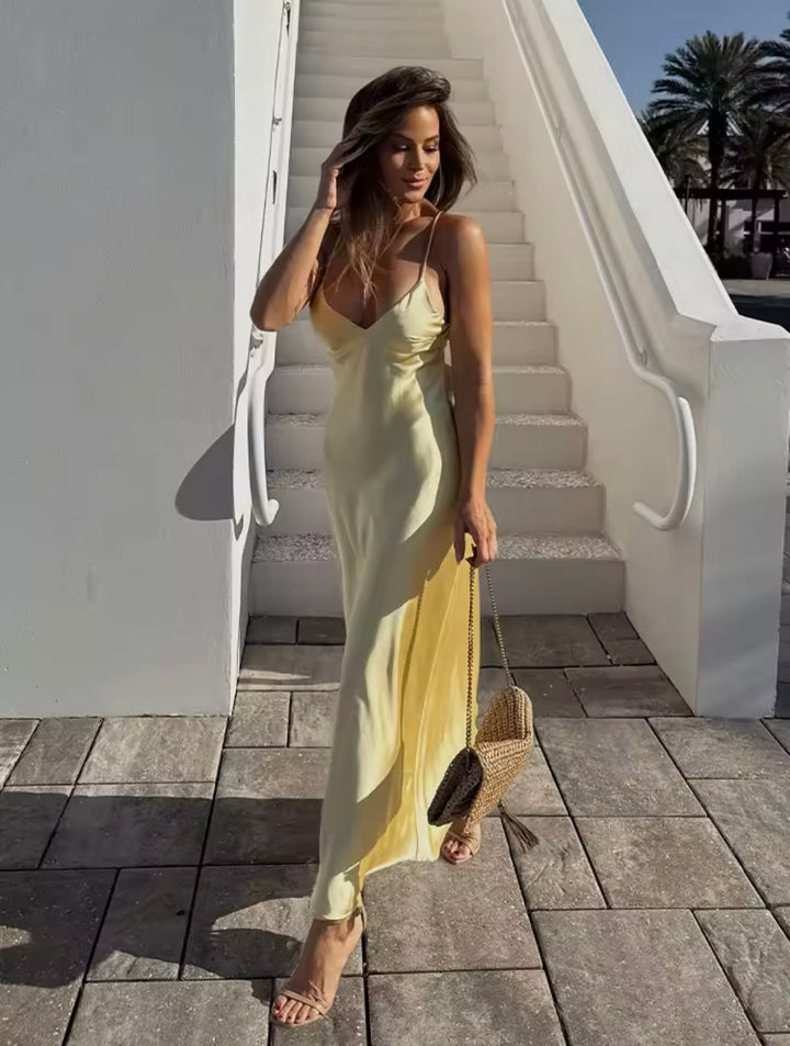Elegant women's slip maxi dress, flowing fabric for evening wear or special occasions.