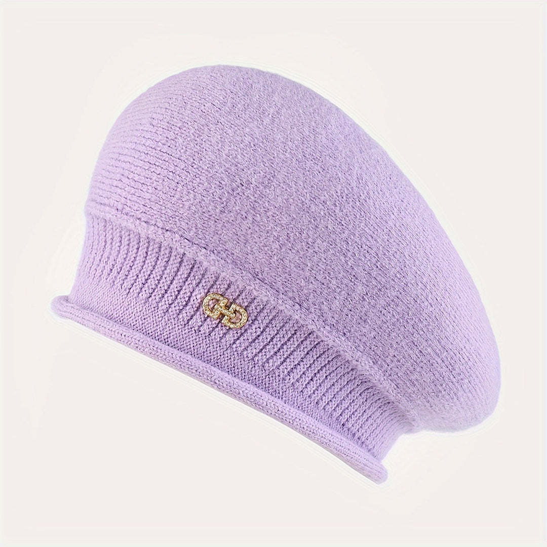 This elegant women's knitted beret provides chic warmth, a must-have winter fashion accessory.