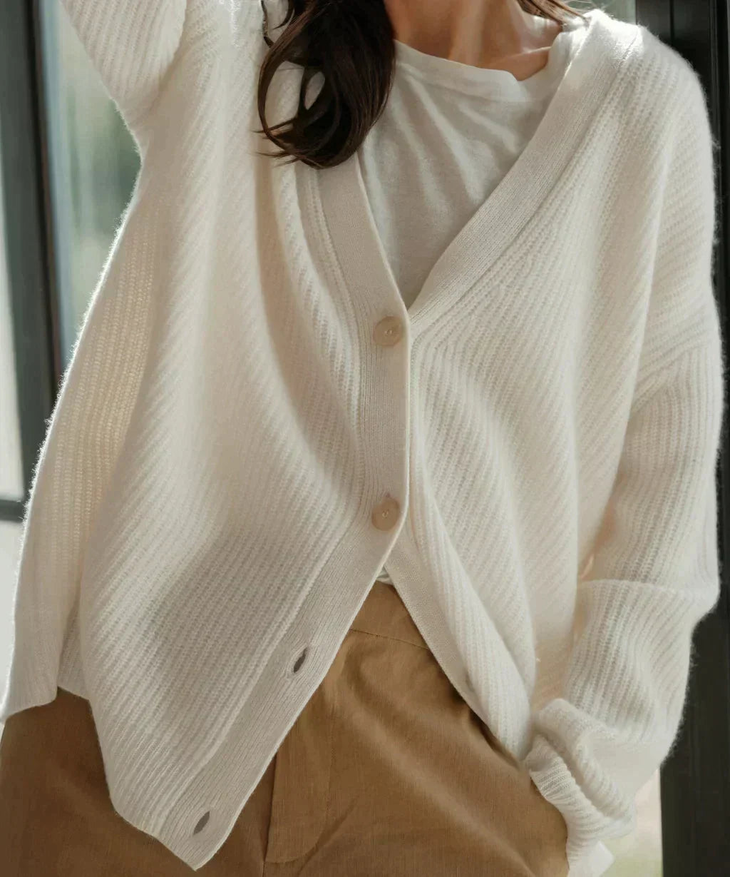 Soft knit long-sleeve cardigan for women, a casual chic layering piece ideal for fall fashion.