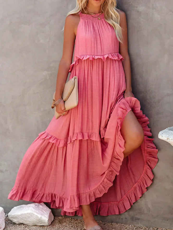 Effortlessly chic white halterneck ruffle maxi dress with pockets, holiday vibes.