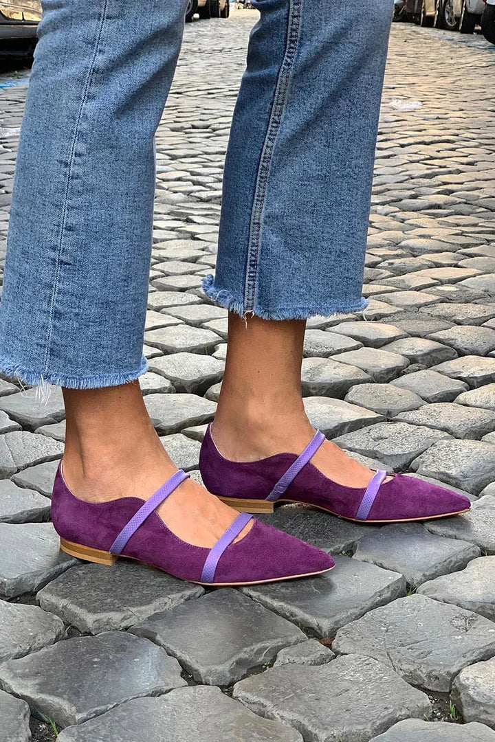 Chic violet double-strap pumps for women. Elegant heels provide comfortable, versatile footwear.
