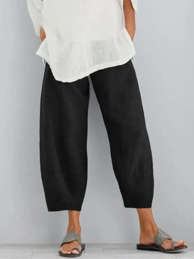 Everyday grey cropped trousers for women. Relaxed fit pants with an elasticated waist and functional pockets.