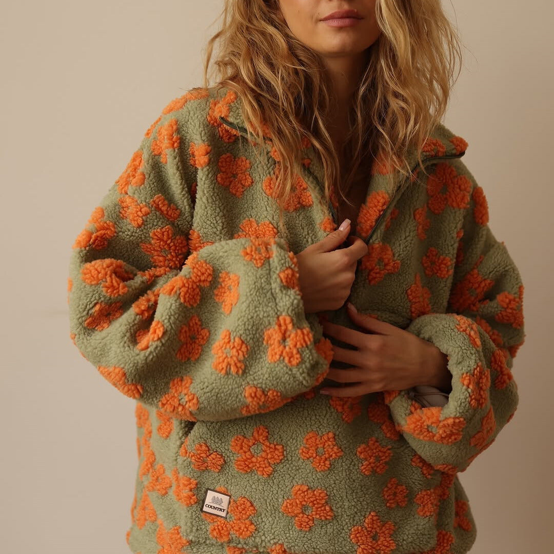 Comfortable women's floral print quarter zip sweater. This stylish long sleeve pullover is a cozy jumper.