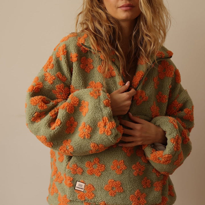 Comfortable women's floral print quarter zip sweater. This stylish long sleeve pullover is a cozy jumper.