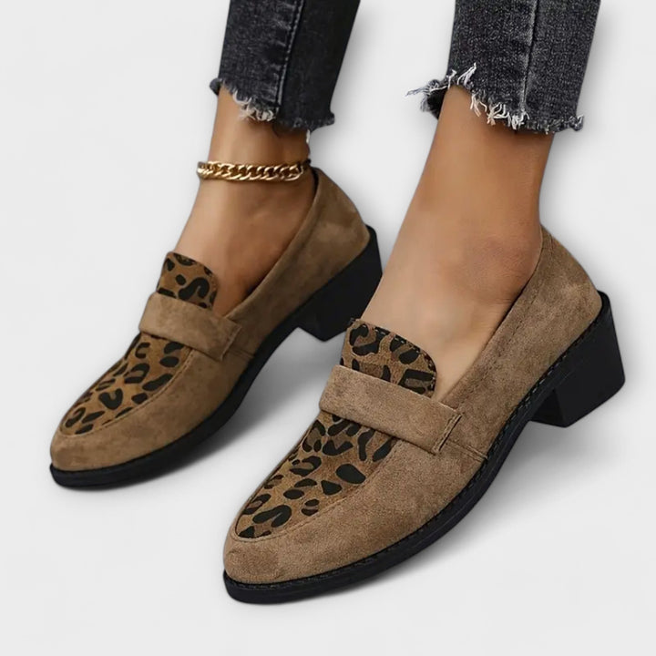 Fashionable women's leopard print slip-on loafers, combining elegance and comfort for modern wear.