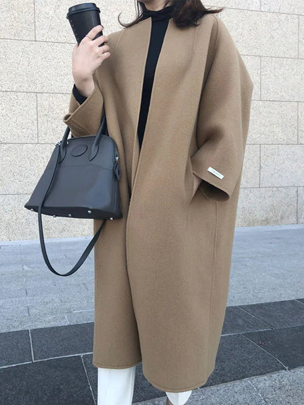 Elegant women's long winter coat in a rich brown shade, perfect for warmth & style.