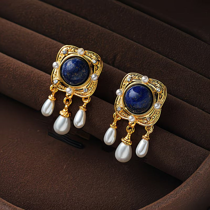 Elegant women's royal blue pearl chandelier earrings, perfect for special occasions. Hypoallergenic drop design.