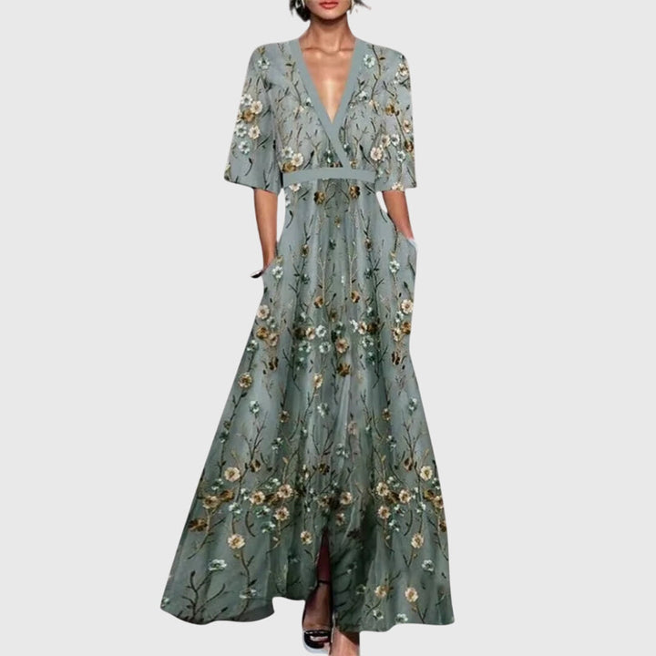 Women's elegant floral maxi dress for spring, featuring a belted waist and long flowy design, ideal for parties.