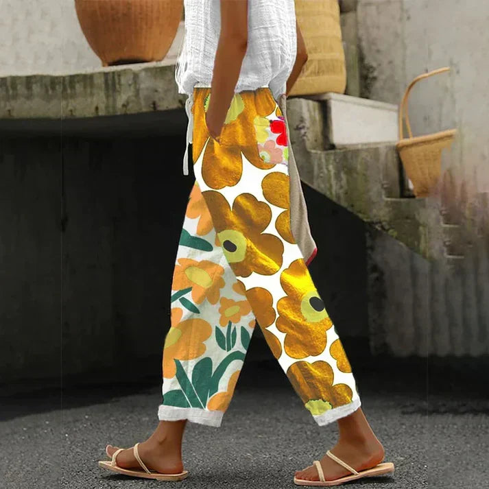 Women's floral print pants. Stylish, comfortable & versatile bottoms for spring/summer fashion. Effortless casual wear.