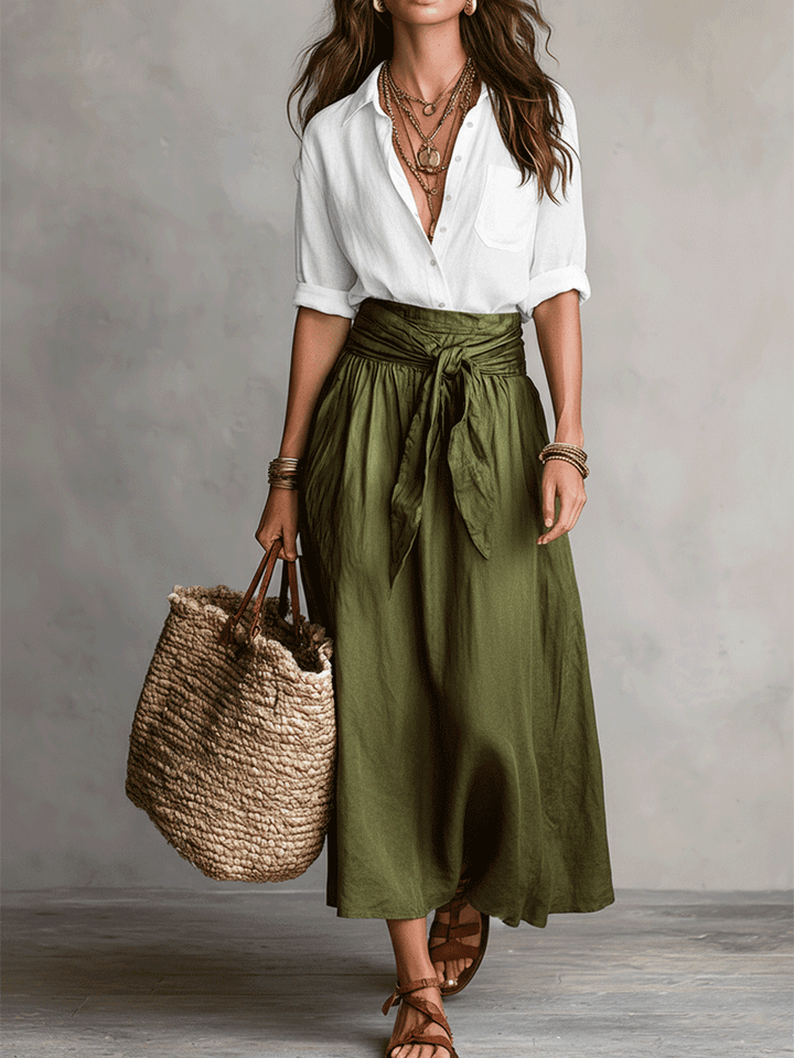 Elegant women's flowing skirt and top co-ord set, versatile and feminine for summer holidays.