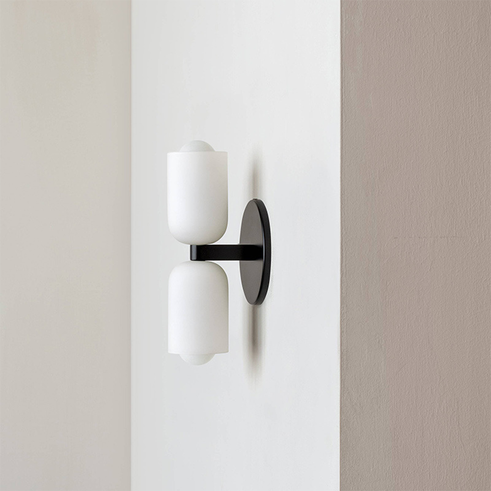 Architectural wall light with uplight & downlight, offering sophisticated ambient lighting.