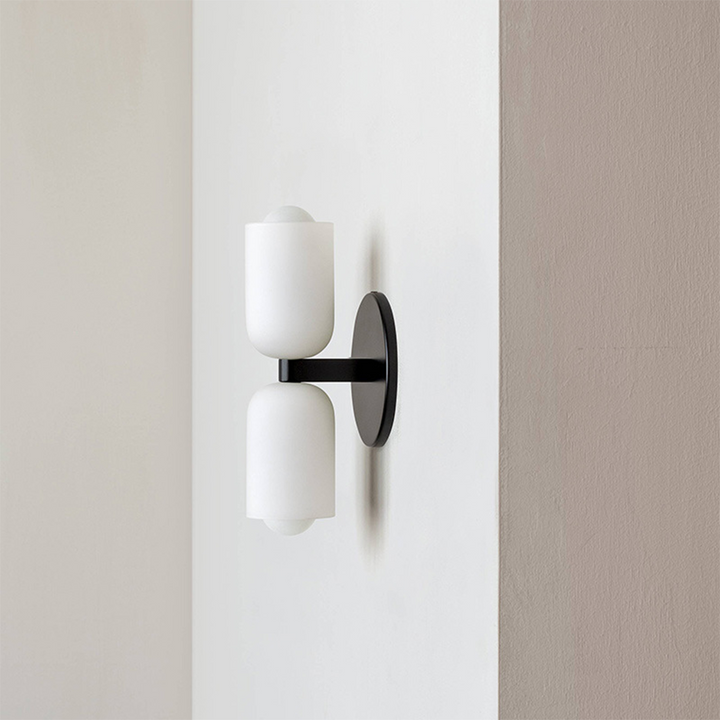 Architectural wall light with uplight & downlight, offering sophisticated ambient lighting.