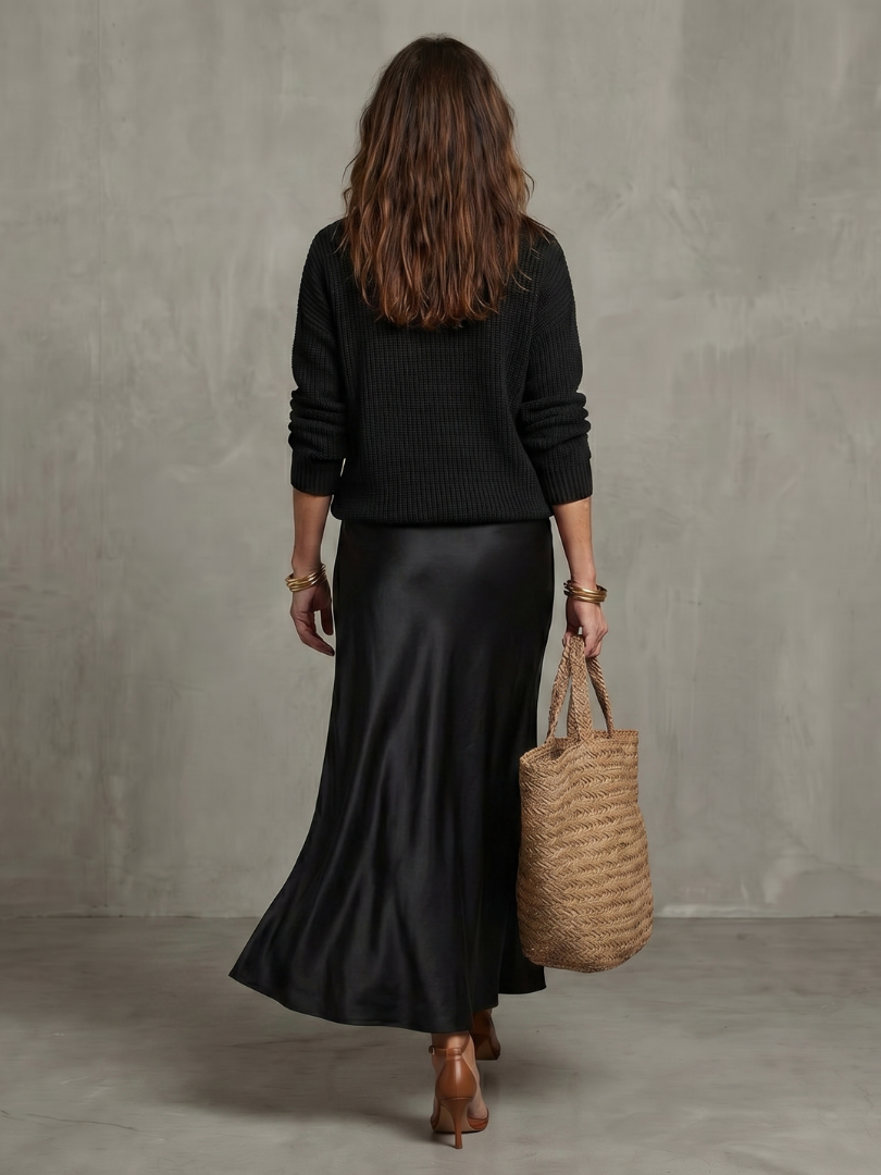 Soft knit women's elegant two-piece sweater & midi skirt set, perfect for comfortable fall fashion.
