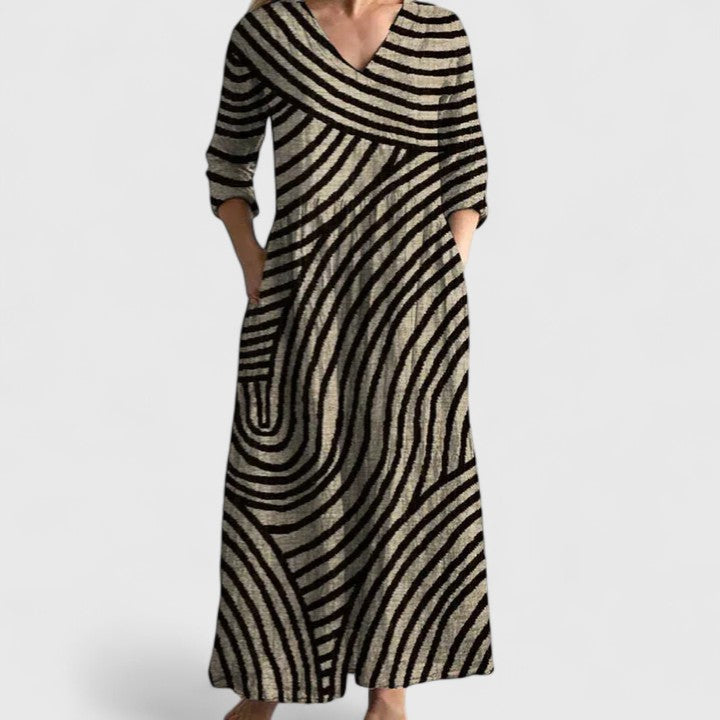 Women's comfortable gold & black geometric print V-neck midi dress for casual everyday spring & summer wear.