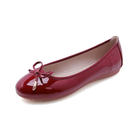 Comfortable women's ballet flats with charming bow detail, perfect for office or casual wear.