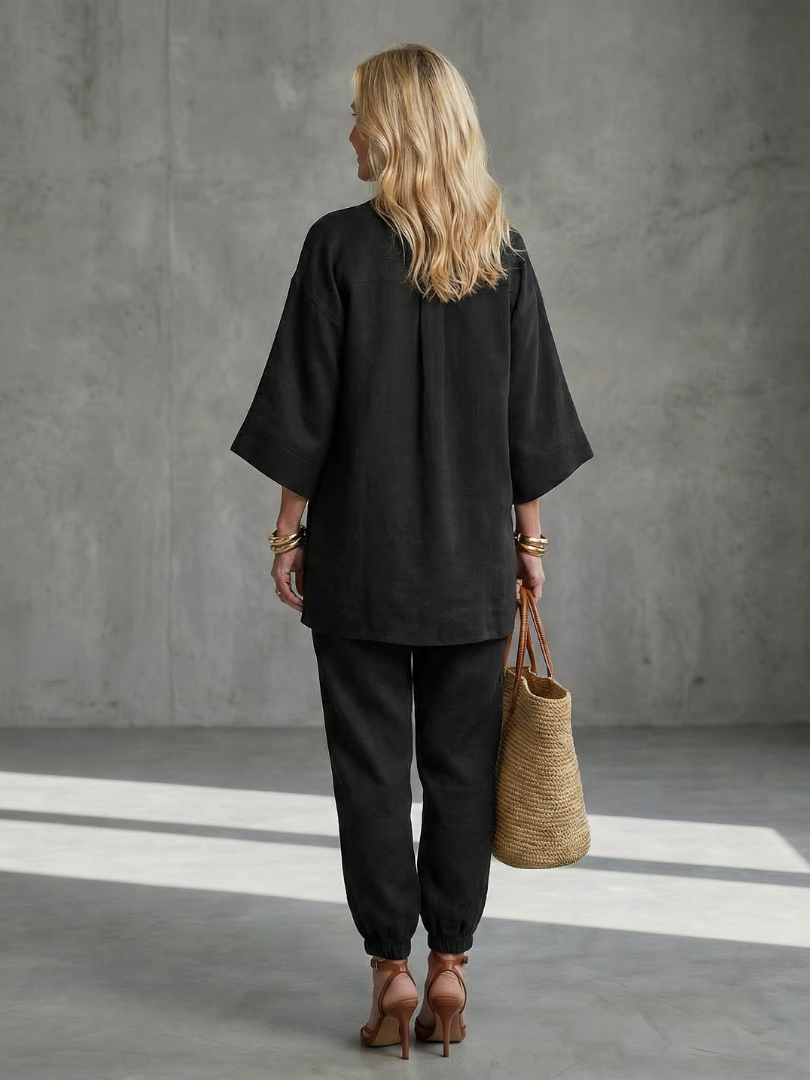 Comfortable women's loungewear two-piece set with V-neck tunic & gathered trousers.
