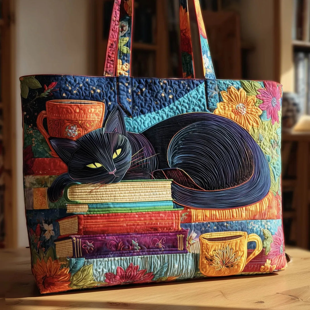Women's handcrafted black cat book lover's padded tote bag. Cute quilted shoulder bag, perfect literary gift.