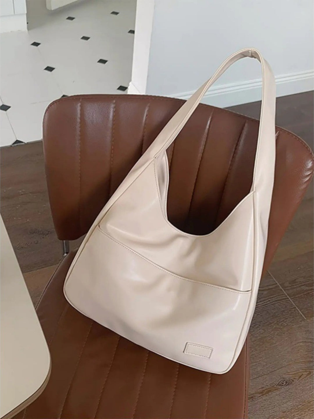 Modern women's vegan leather shoulder bag. Everyday tote for school, work, or a chic casual ensemble.