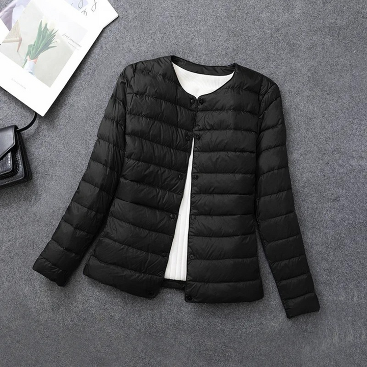 Women's everyday lightweight down puffer jacket. Offers warmth & comfort, perfect for fall & winter versatility.
