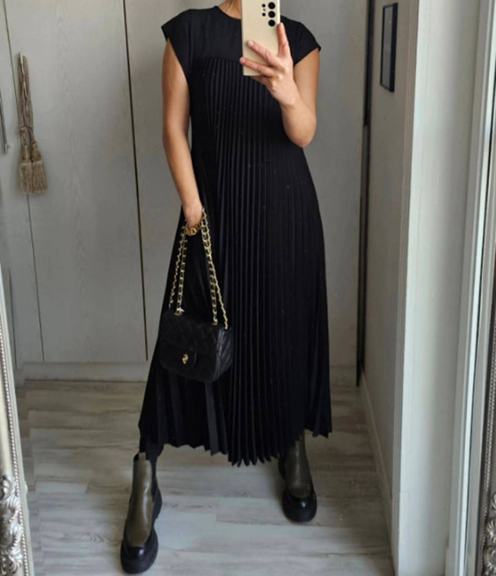 Chic pleated women's comfort dress. Versatile for casual outings or formal events.