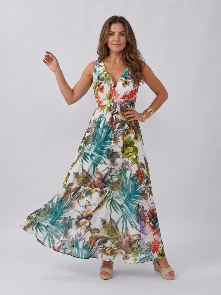 Stylish women's tropical print sleeveless midi dress, empire waist, offering casual elegance for summer outings.
