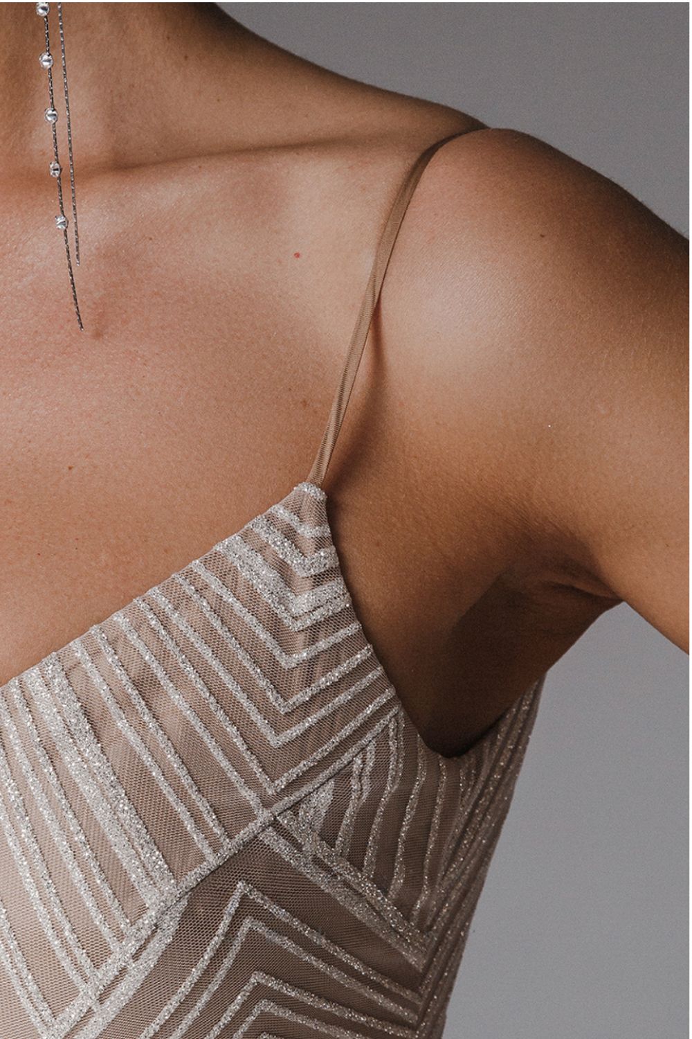 Beautiful women's V-neck A-line dress with slender straps, perfect for elegant parties or events.