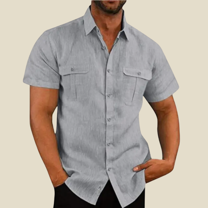 Versatile men's relaxed fit short-sleeve shirt with dual chest pockets, great for comfortable everyday summer fashion.
