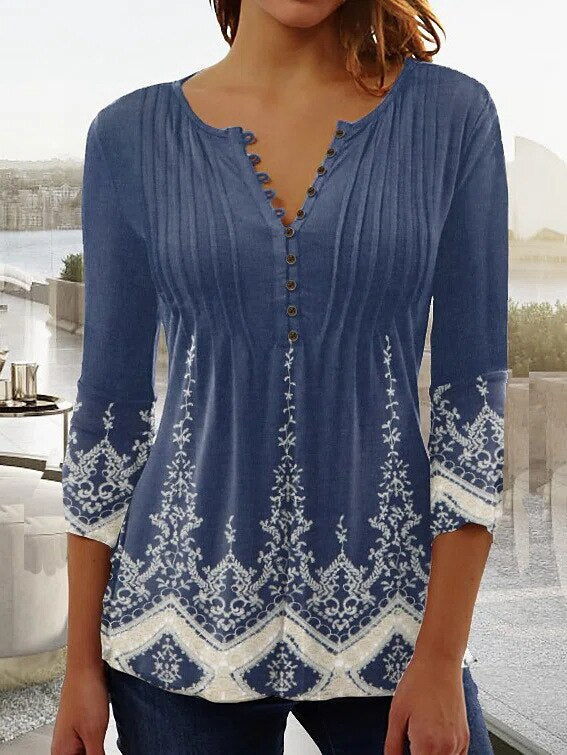 Chic women's elegant long sleeve top. Versatile everyday fashion for office or casual wear.