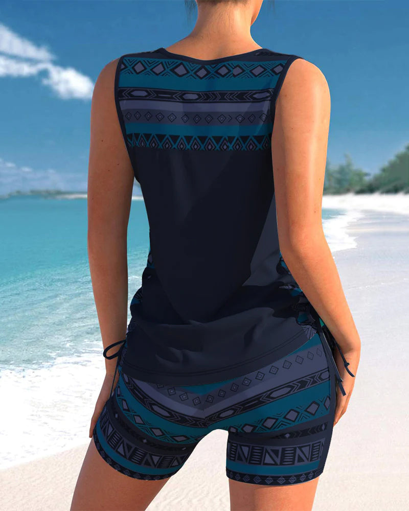 Explore the beach in style with this women's printed criss-cross tankini two-piece swimwear.