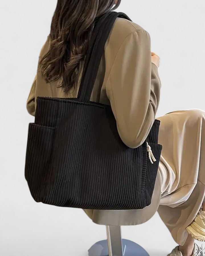 Chic everyday women's bag: a sophisticated corduroy tote, functioning as a versatile handbag.