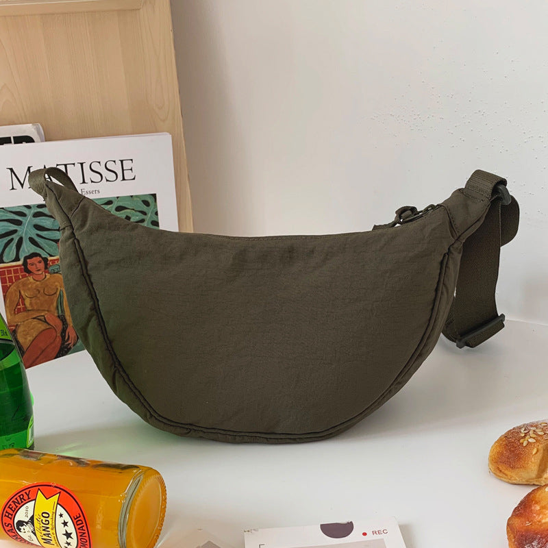 Everyday Women's Half Moon Purse, a stylish and practical shoulder bag for various activities.