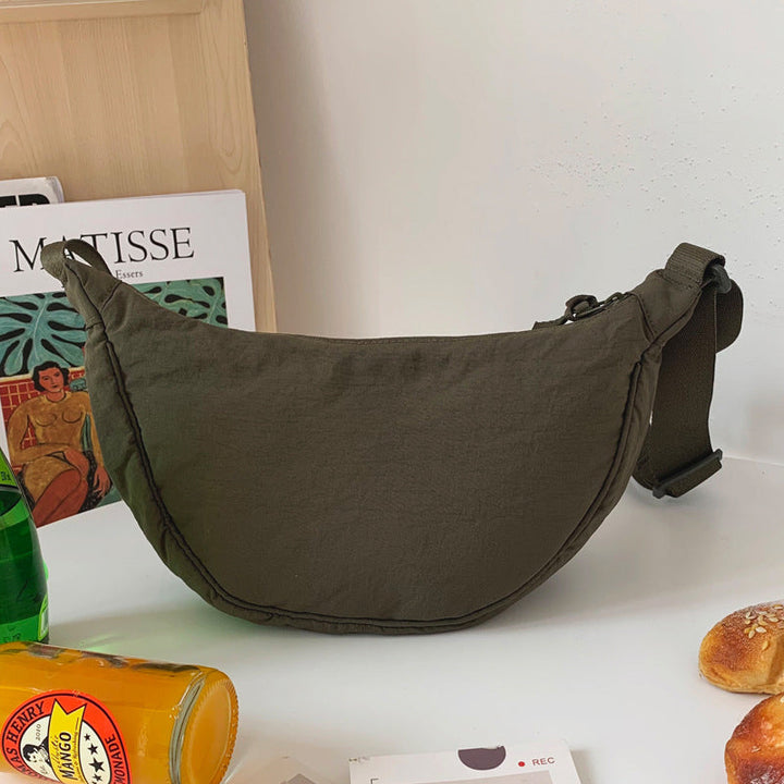Everyday Women's Half Moon Purse, a stylish and practical shoulder bag for various activities.