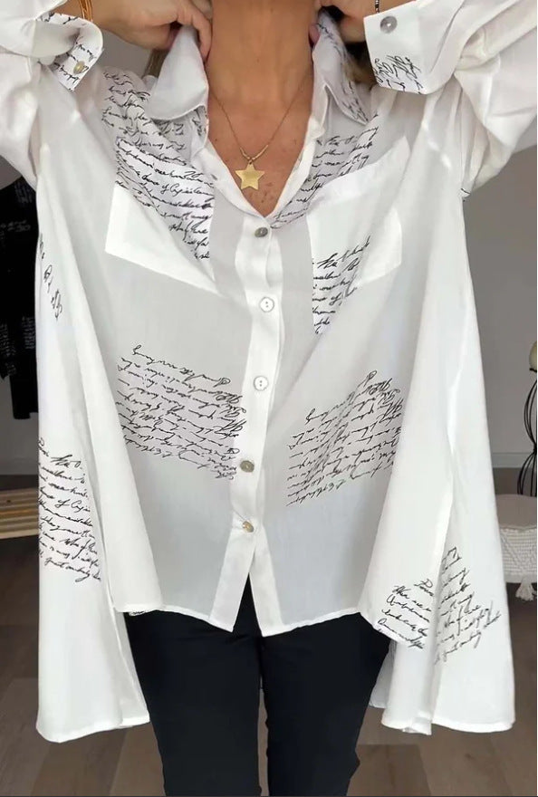 Women's oversized script print button-up shirt. Casual chic long sleeve top for versatile everyday fashion.